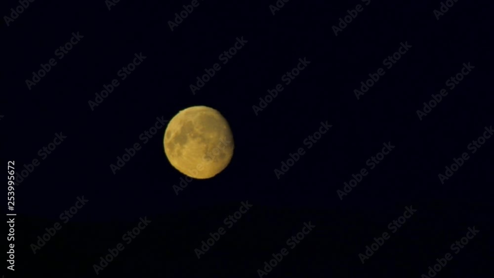 An amazing bright full moon against a clear black night sky. An amazing bright full moon against a clear black night sky.