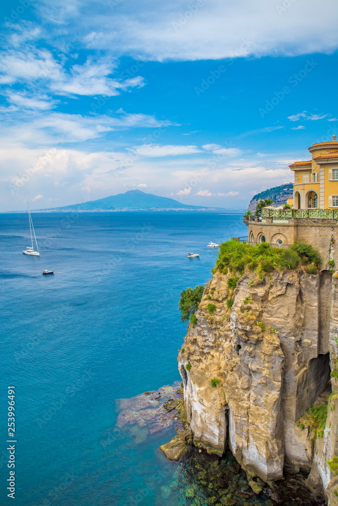 Naples, Sorrento Italy - August 10, 2015 : A view of the sea with the ships and Mount Vesuvius in the background.
