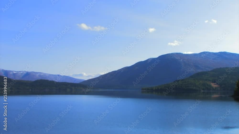 Panoramic view of the coast, full of vegetation and with beautiful mountains in the background Panoramic view of the coast, full of vegetation and with beautiful mountains in the background