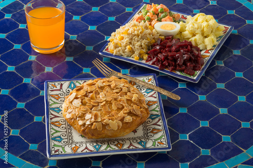 Single fresh baked traditional Moroccan small bastella and salade photo