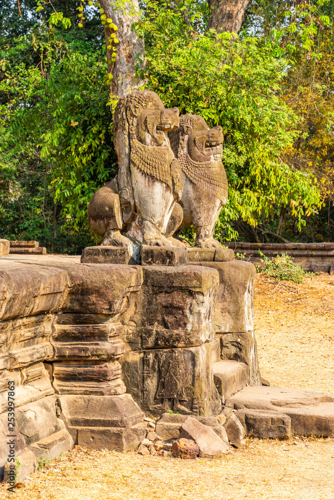 Preah Ko temple, Cambodia: Khmer style guardian lions sculptures