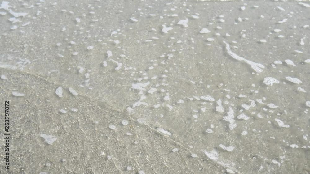 Tropical ocean seascape scenery with wave crashing on sandy shore. Tropical ocean seascape scenery with wave crashing on sandy shore.
