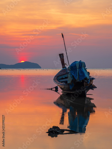 Traditionnal Long tail boat at sunset