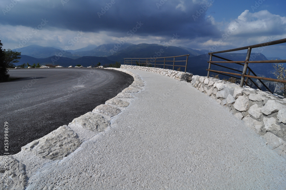 pantone classic blue winding mountain road in verdon canyon cote azur in front of dramatic blue sky and clouds pantone classic blue winding mountain road in verdon canyon cote azur in front of dramatic blue sky and clouds