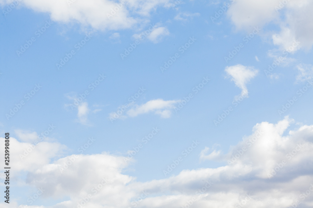 Blue sky background with clouds. White clouds on blue sky