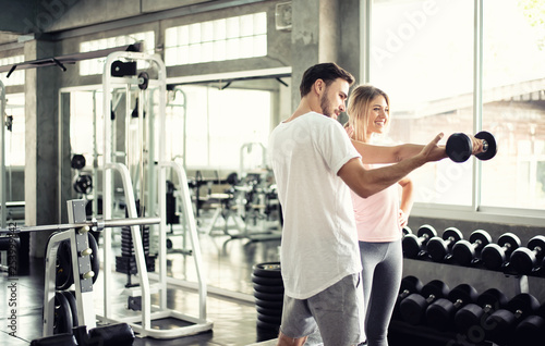 Portrait Fitness coaches are controlling the training equipment of lovers, Helps create motivation for exercise,fitness concept 
