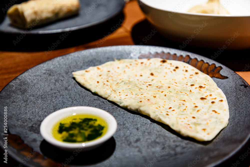Kutab, a traditional Arabic dish, lies on a plate Kutab, a traditional Arabic dish, lies on a plate