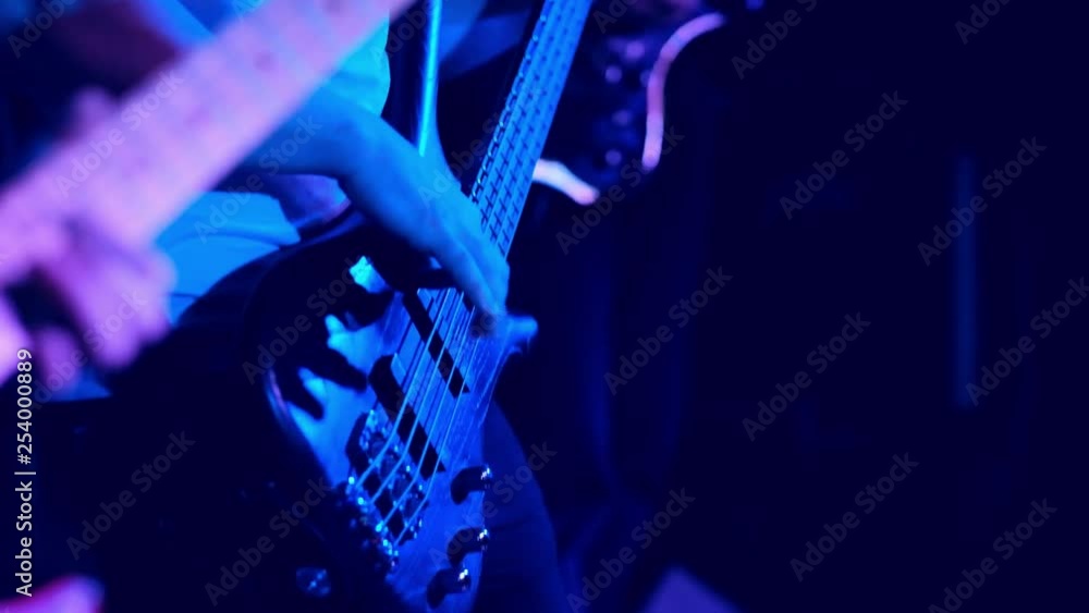 guitar player playing ona the guiter on the stage, close up