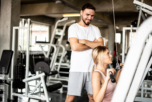 Portrait Fitness coaches are controlling the training equipment of lovers, Helps create motivation for exercise,fitness concept 
