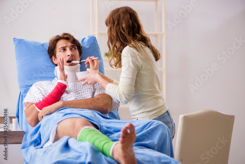Loving wife looking after injured husband in hospital  © Elnur