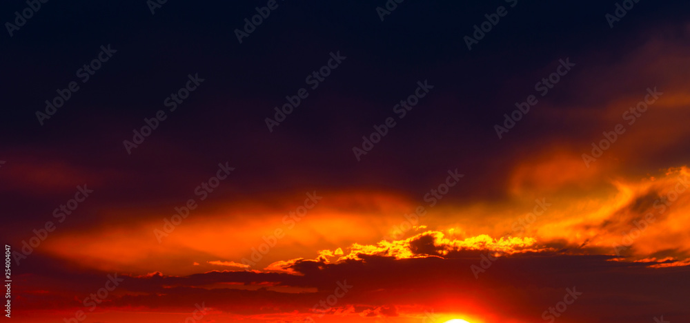 Beautiful sunset with dramatic clouds on the sky Beautiful sunset with dramatic clouds on the sky