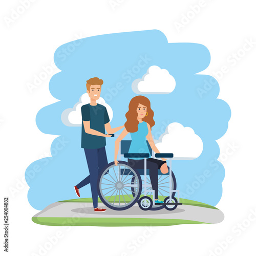 young woman in wheelchair with male helper