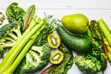 Green food background. Healthy green vegetables and fruits, top view.