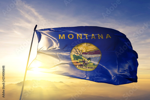 Canvastavla Montana state of United States flag waving on the top sunrise mist fog