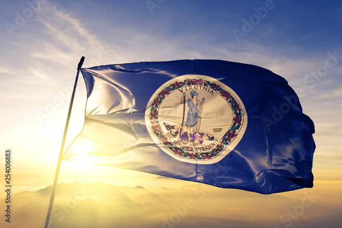 Obraz na plátně Virginia state of United States flag waving on the top sunrise mist fog