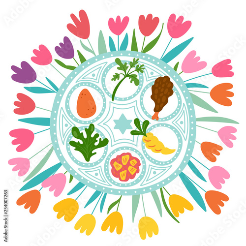 Passover holiday cute traditional seder plate and spring flowers.