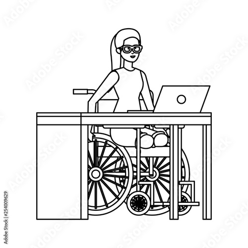 young woman in wheelchair working in the office