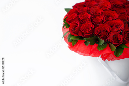 bouquet of red rosesbouquet of red roses in a white box on a white background isolated photo