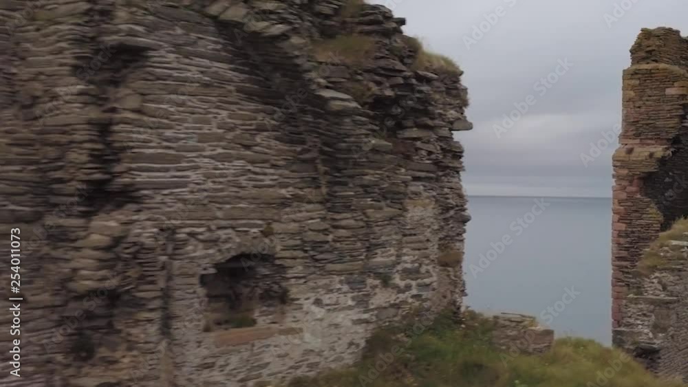a very old medieval castle ruin at the coast of Scotland a very old medieval castle ruin at the coast of Scotland
