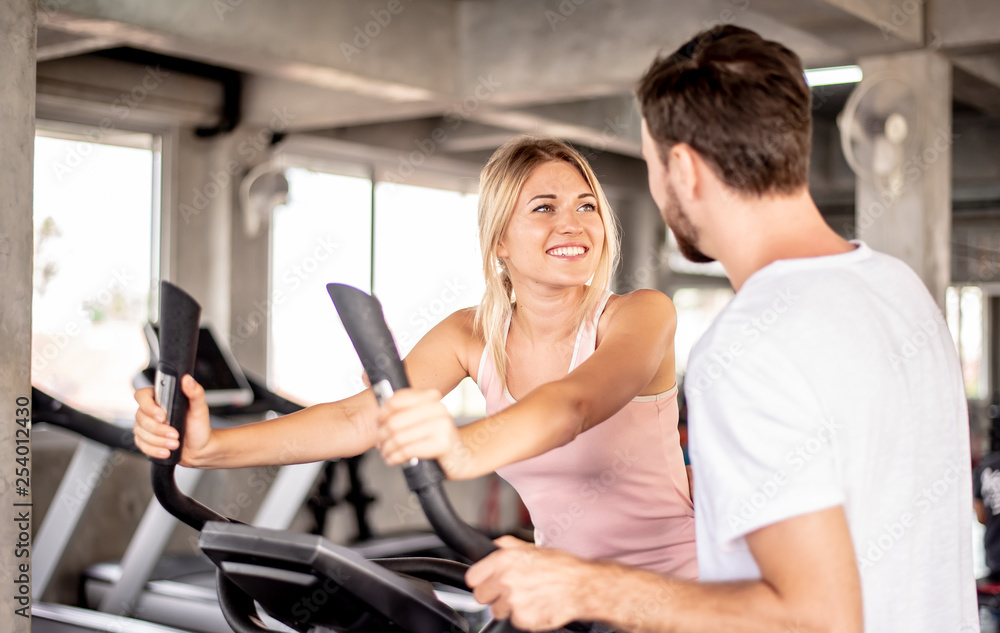 coach teaches correct using fitnes equipment,Portrait Fitness coaches are controlling the training equipment coach teaches correct using fitnes equipment,Portrait Fitness coaches are controlling the training equipment