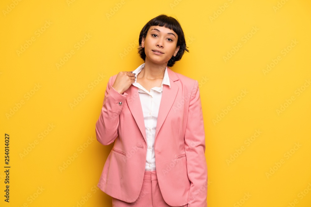 Modern woman with pink business suit with tired and sick expression