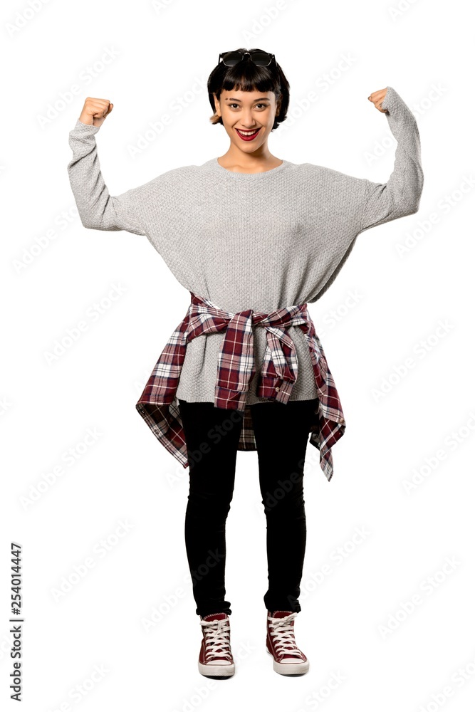A full-length shot of a Young woman with short hair proud and self-satisfied over isolated white background A full-length shot of a Young woman with short hair proud and self-satisfied over isolated white background