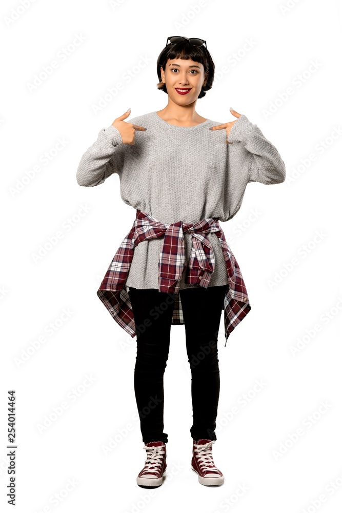 A full-length shot of a Young woman with short hair with surprise facial expression over isolated white background A full-length shot of a Young woman with short hair with surprise facial expression over isolated white background