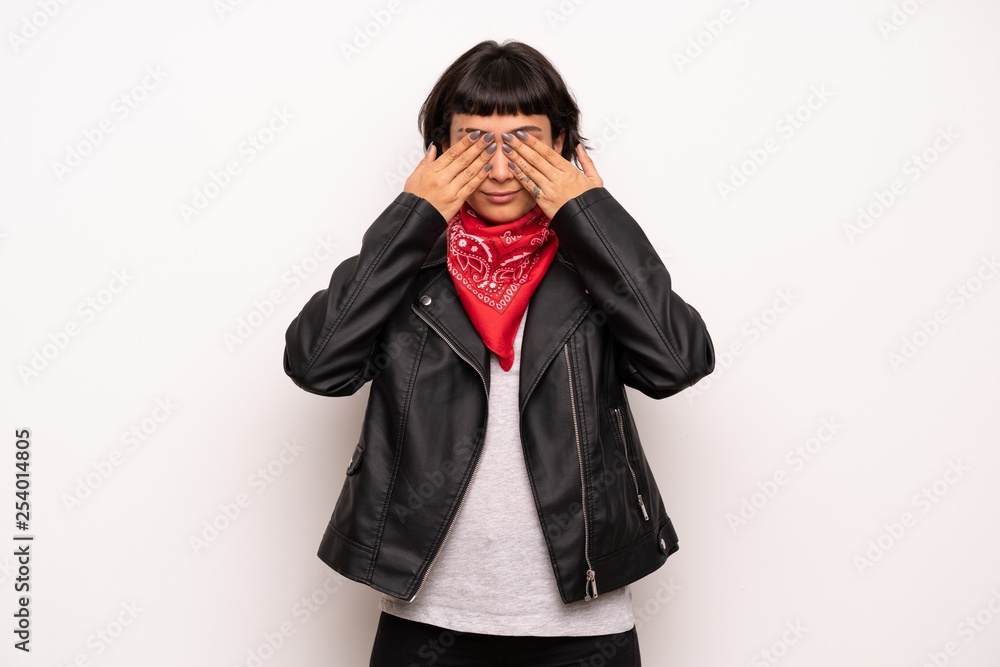 Woman with leather jacket and handkerchief covering eyes by hands. Do not want to see something Woman with leather jacket and handkerchief covering eyes by hands. Do not want to see something