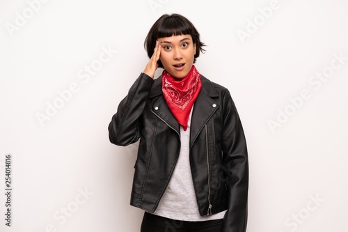 Woman with leather jacket and handkerchief has just realized something and has intending the solution © luismolinero