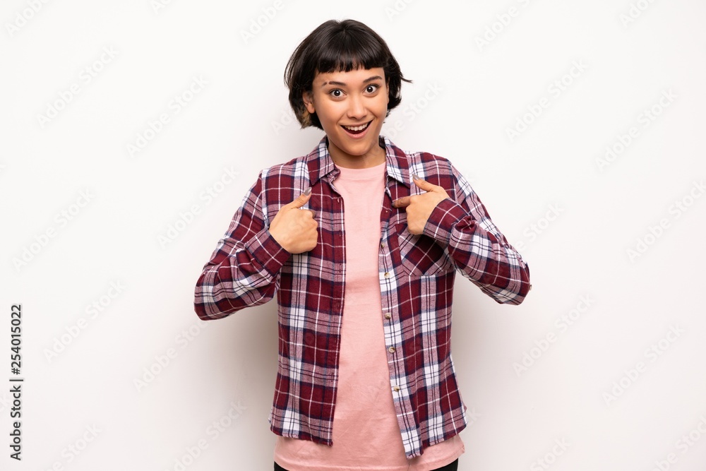 Young woman with short hair with surprise facial expression Young woman with short hair with surprise facial expression