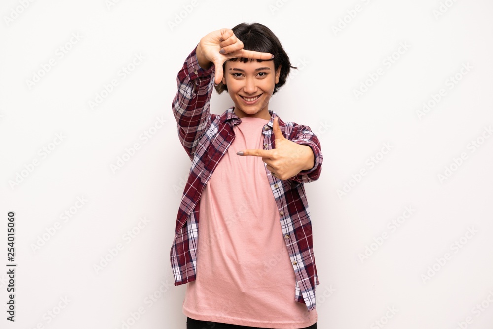Young woman with short hair focusing face. Framing symbol Young woman with short hair focusing face. Framing symbol
