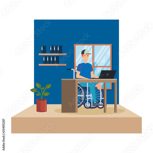 young man in wheelchair working in the office