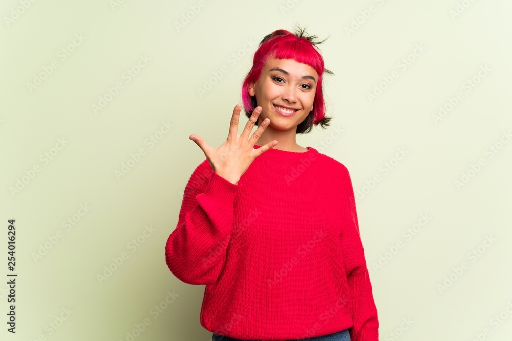 Young woman with red sweater counting five with fingers Young woman with red sweater counting five with fingers