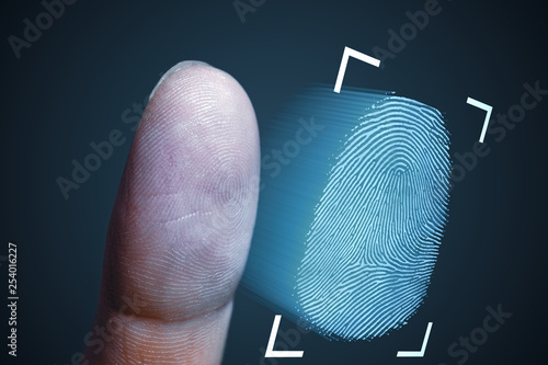 Fingerprint scanning from finger. Technology, security and biometrics concept. photo