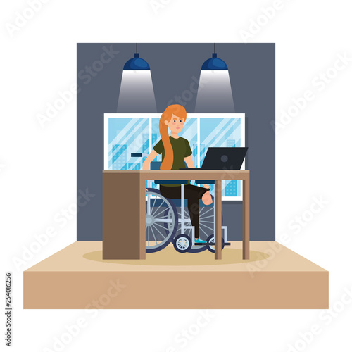 young man in wheelchair working in the office