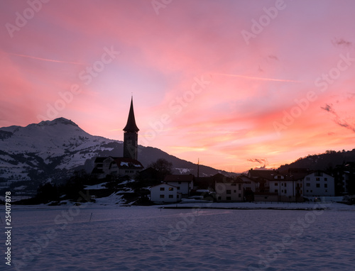 Swiss mountain town Sagogn in a beautiful winter sunset.