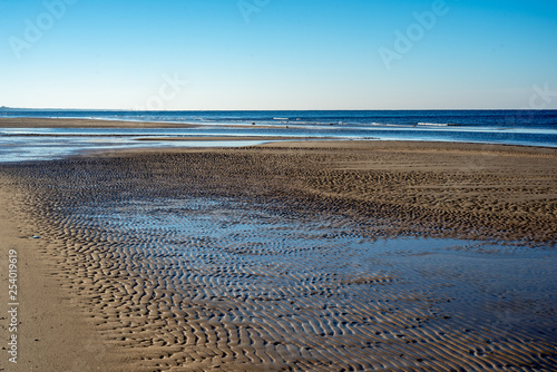 empty sandy beach by the sea