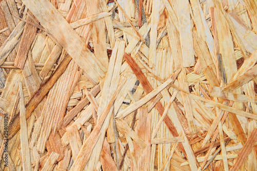 Oriented strand board. Wood sheet plywood. Close-up. Background. Texture.
