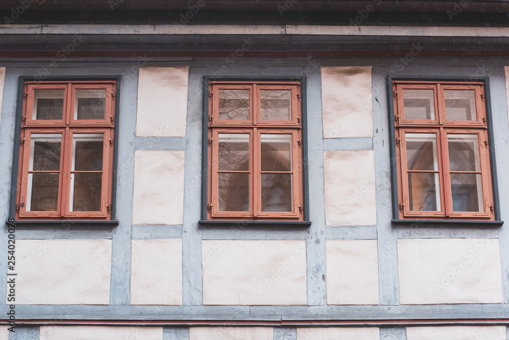 three windows in a half-timbered house with reflection in Germany, Fachwerkhaus