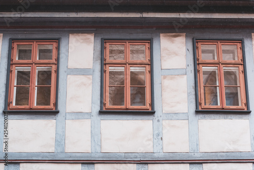 three windows in a half-timbered house with reflection in Germany, Fachwerkhaus © D. Jakli