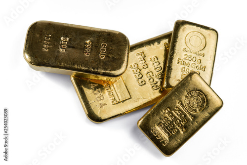 Several gold bars of different weight isolated on white background.