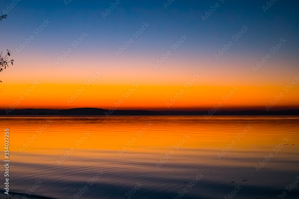 Incredible, bright sunset over the water. Minsk Sea, Belarus