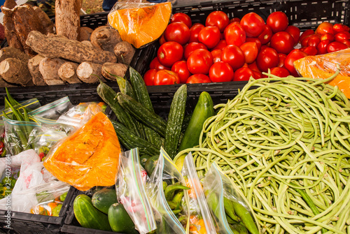 Canvas Print Fresh fruit and vegetables are on display in a local farmers market on the Caribbean island of Grand Cayman