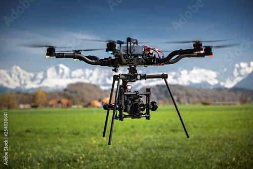 Big professional camera drone in mid-air