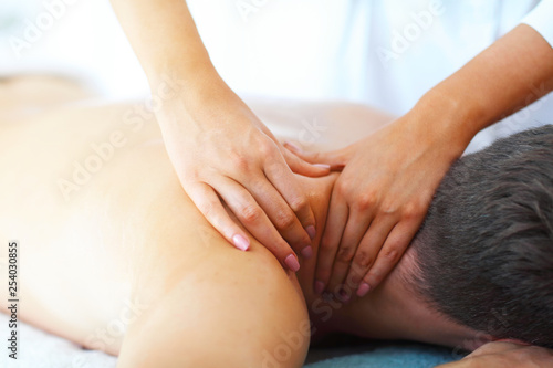 Fototapeta Naklejka Na Ścianę i Meble -  Handsome man having massage in spa salon