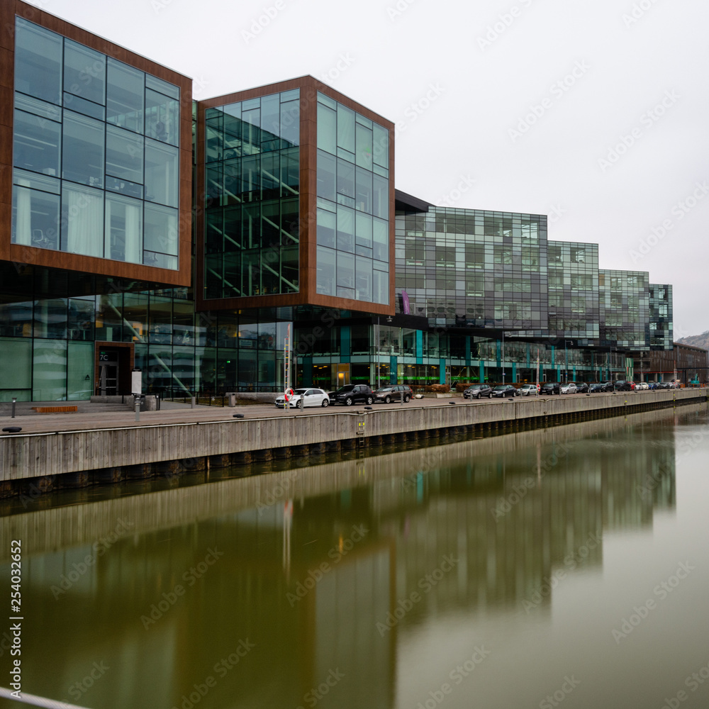 Modern buildings reflected in water at Lindholmen science park gothenburg,sweden Modern buildings reflected in water at Lindholmen science park gothenburg,sweden