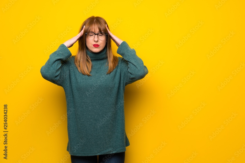 Woman with glasses over yellow wall unhappy and frustrated with something Woman with glasses over yellow wall unhappy and frustrated with something