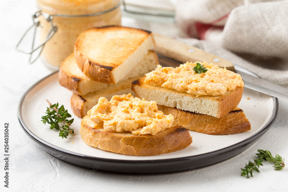 Chicken pate with carrots on toast bread, delicious spread for Breakfast. Healthy food, vegetable snack, wine aperitizer Chicken pate with carrots on toast bread, delicious spread for Breakfast. Healthy food, vegetable snack, wine aperitizer
