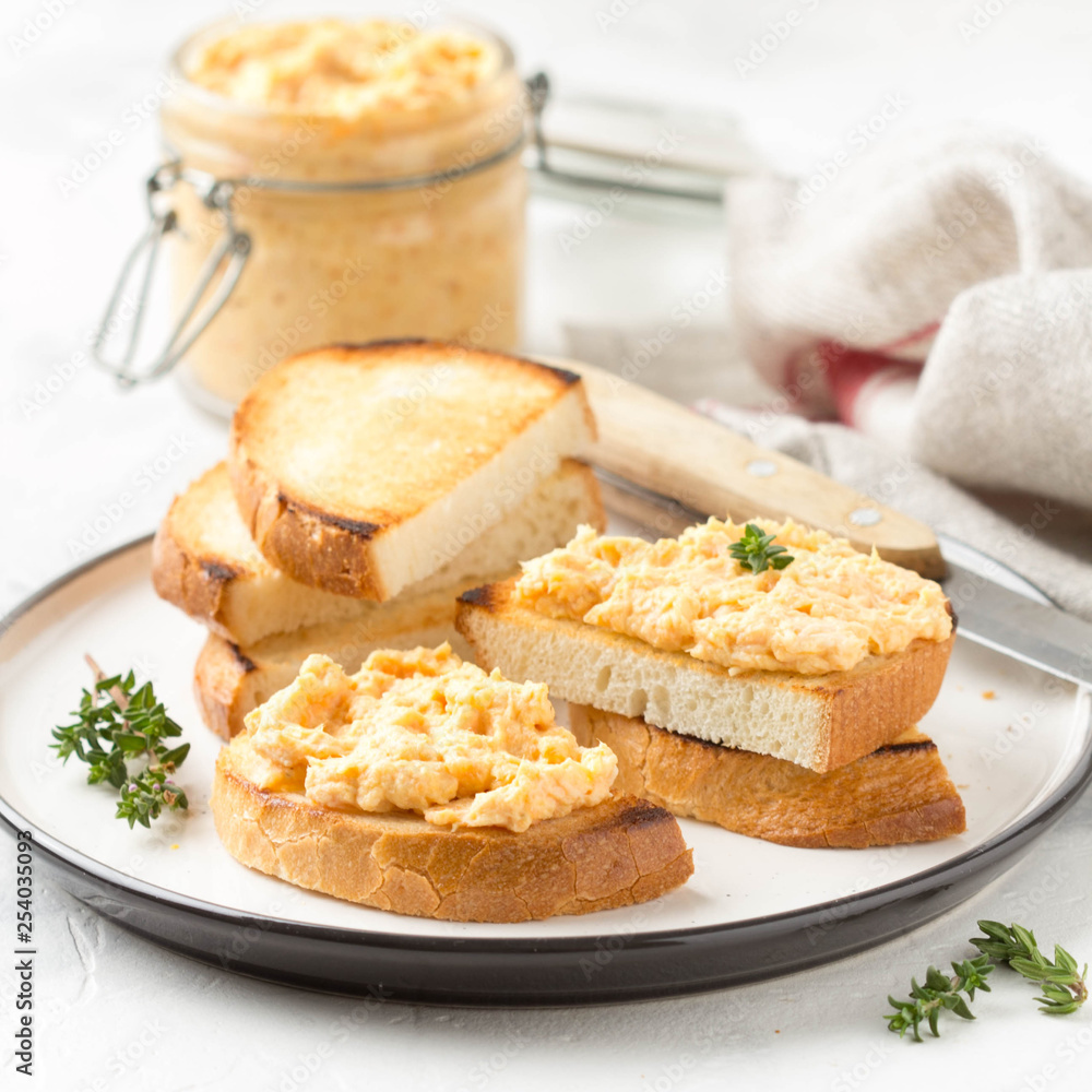 Chicken pate with carrots on toast bread, delicious spread for Breakfast. Healthy food, vegetable snack, wine aperitizer Chicken pate with carrots on toast bread, delicious spread for Breakfast. Healthy food, vegetable snack, wine aperitizer