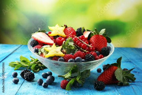 salad with fresh fruits and berries. healthy spring fruit salad  with strawberries